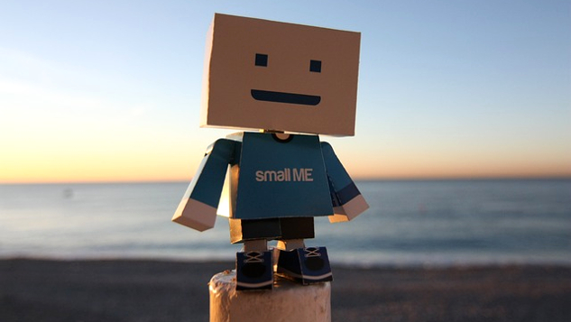 "small me" figure with a cardboard head